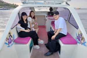 Sunset Adventure: Japanese Friends Set Sail from Teluk Nare to Gili Trawangan on a Private Speedboat for an Unforgettable Island Arrival