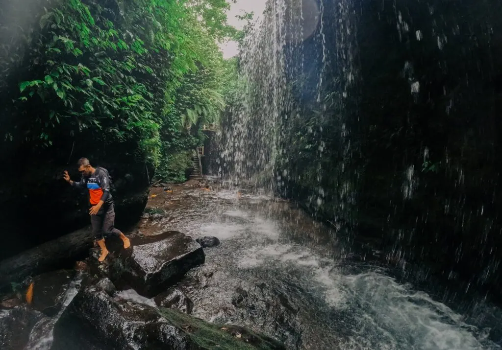 Riders on waterfall and jungle dirt bike trails in Central Lombok